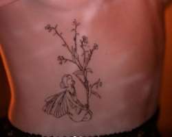 She got her first tattoo on her waist just below her chest in February 2022.